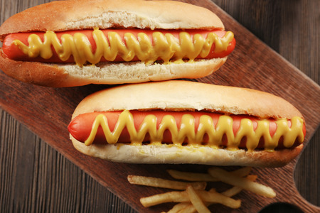 Hot dogs on cutting board closeupの写真素材