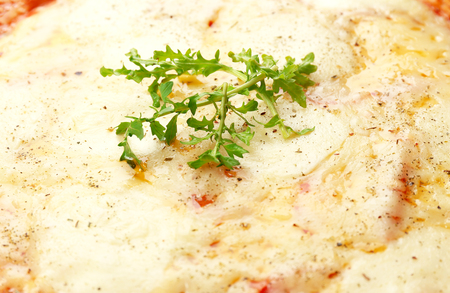 Pizza full of cheese backgroundの写真素材