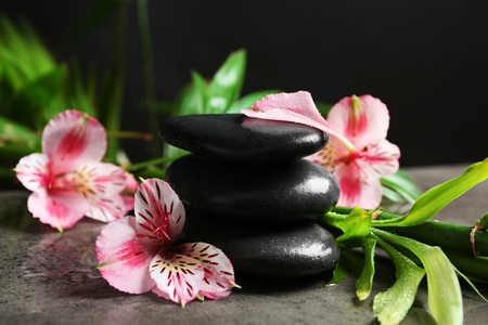 Beautiful spa composition with roses, bamboo and stonesの写真素材