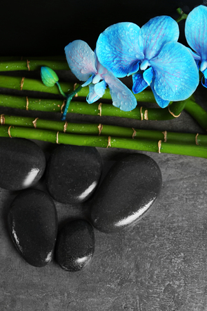Beautiful spa composition with blue orchid, bamboo and stonesの写真素材