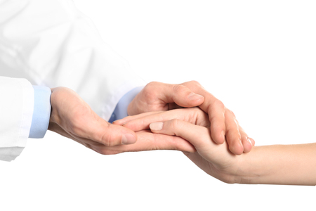 Hand of medical doctor carefully holding patient's handsの写真素材