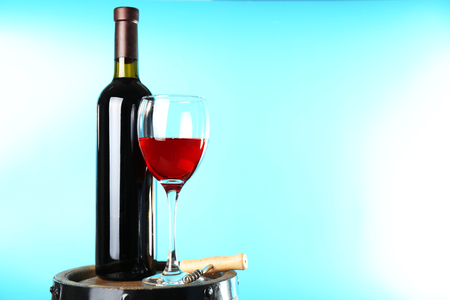 Wine on barrel on blue natural backgroundの写真素材