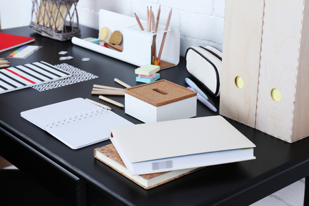 Office and school set with stationery and notebooks on a tableの写真素材