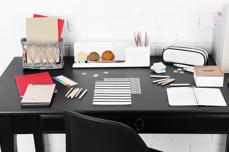 Office and school set with stationery and notebooks on a tableの写真素材