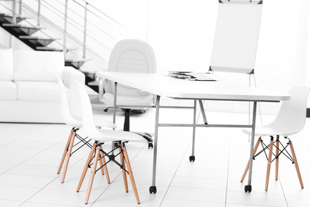 White table and chairs in office interiorの写真素材