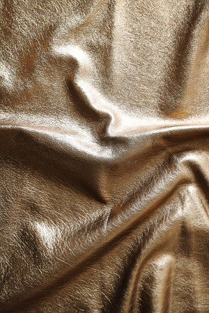 Silver cloth texture with uneven crumpled surfaceの写真素材