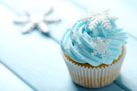 Blue cupcake on wooden backgroundの写真素材