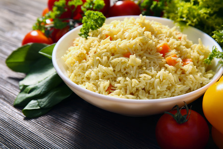 Dish of vegetarian rice on wooden table closeupの写真素材