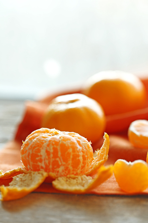 Tangerines on old wooden table, close upの写真素材