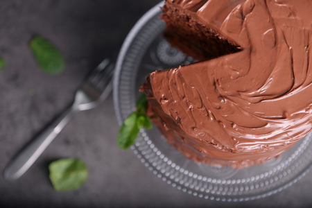 Chocolate pie with mint and fork on grey backgroundの写真素材