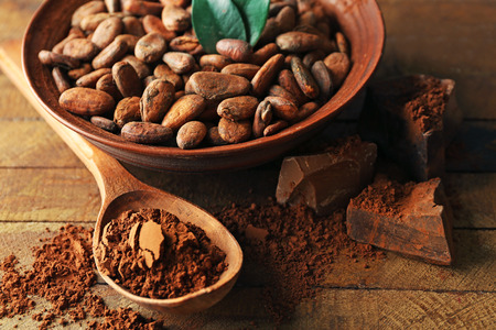 Aromatic cocoa harvest on wooden background, close upの写真素材