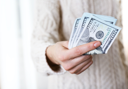 Hand holds money, close upの写真素材