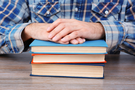 Man working with books, close upの写真素材