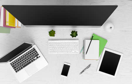 Workplace with computer, tablet, smart phone and other things, top viewの写真素材