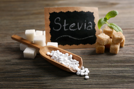 Word STEVIA written on black board and sugar on wooden backgroundの写真素材