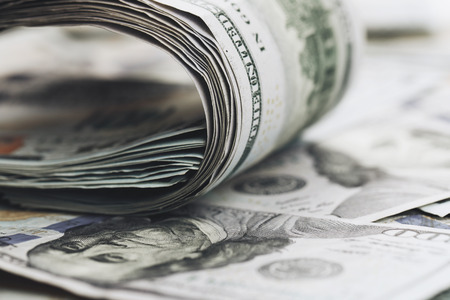 Twisted dollar banknotes, close up