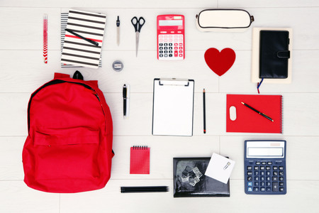 School set with backpack, heart and supplies on light wooden backgroundの写真素材