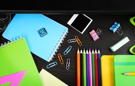 Stationery in open desk drawer, top viewの写真素材