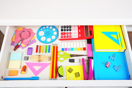 Stationery in open desk drawer, top viewの写真素材