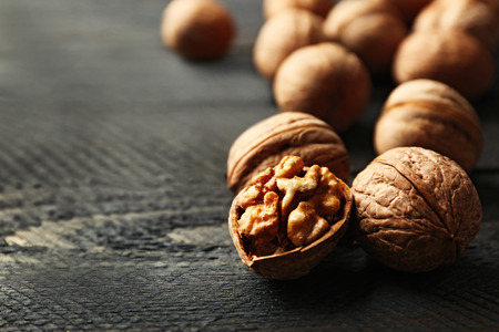 Walnuts on grey wooden tableの写真素材