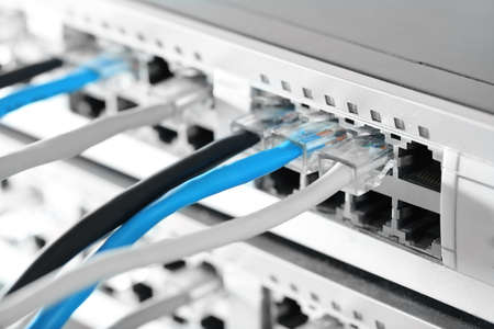 Ethernet cables connected to network switch, close up