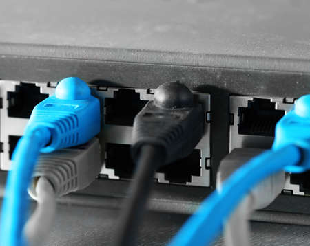 Ethernet cables connected to network switch, close up