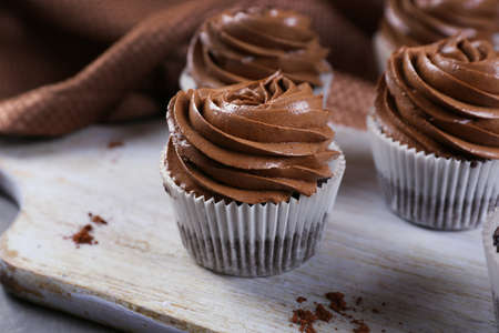Chocolate cupcakes on a tray, close up