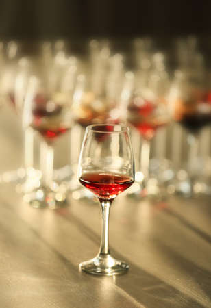Glass of red wine on a table, close upの写真素材