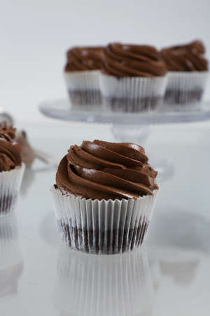 Chocolate cupcake on light glass background, close upの写真素材