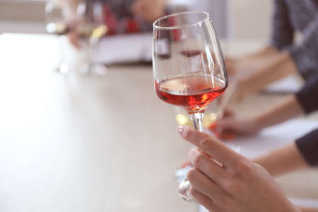 Experts tasting new sorts of wine at the table