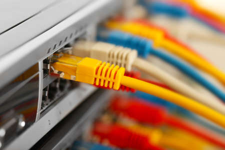 Lan cables connected to network switch, close up