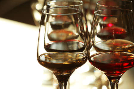 Many glasses of different wine in a row, close upの写真素材