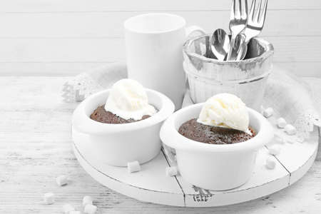 Served table of chocolate lava cake with ice-creamの写真素材