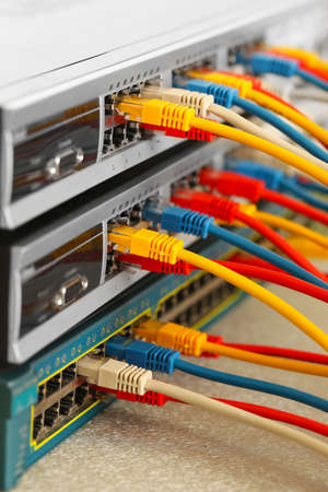 Ethernet cables connected to network switch, close upの写真素材