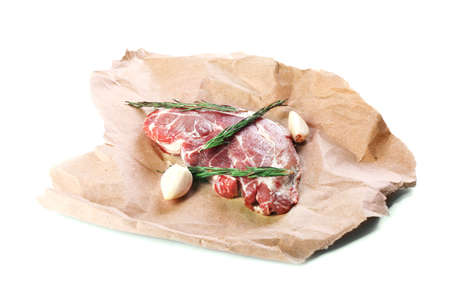 Raw pork steak with spices, isolated on whiteの写真素材