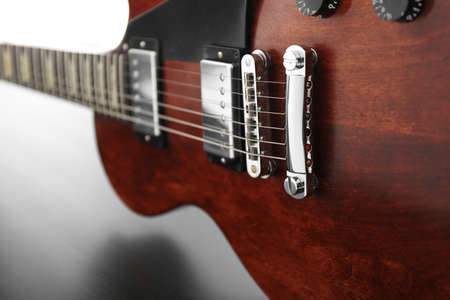 Brown electric guitar on black wooden background, close upの写真素材