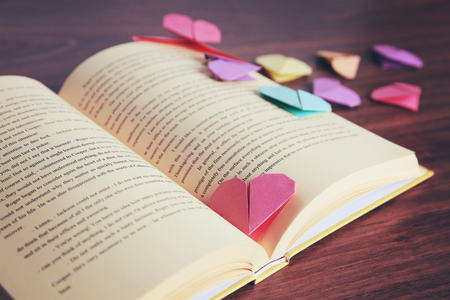 Heart bookmarks for book on wooden table closeupの写真素材