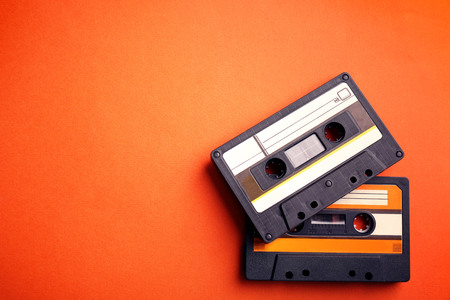 Old audio cassettes on red backgroundの写真素材