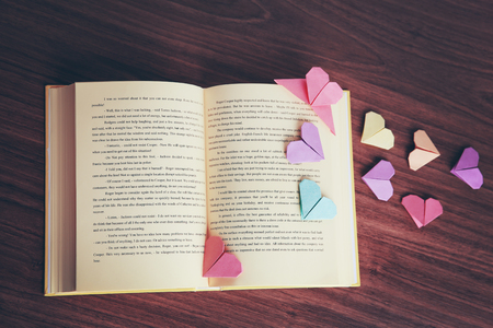 Heart bookmarks for book on wooden backgroundの写真素材