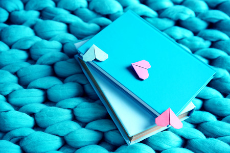 Heart bookmark for book on wicker blue fabric closeupの写真素材