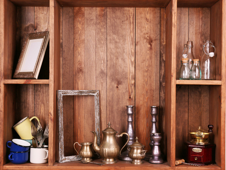 Wooden shelves with antiques thingsの写真素材