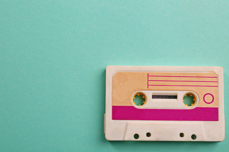 Old audio cassette on turquoise backgroundの写真素材