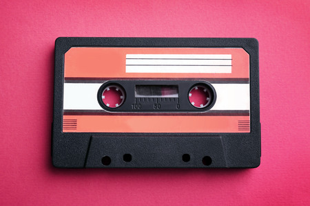 Old audio cassette on red backgroundの写真素材