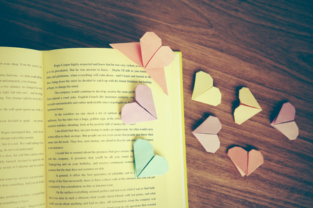 Heart bookmarks for book on wooden backgroundの写真素材