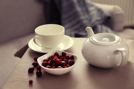 Rose hip tea on the table in the room, closeupの写真素材