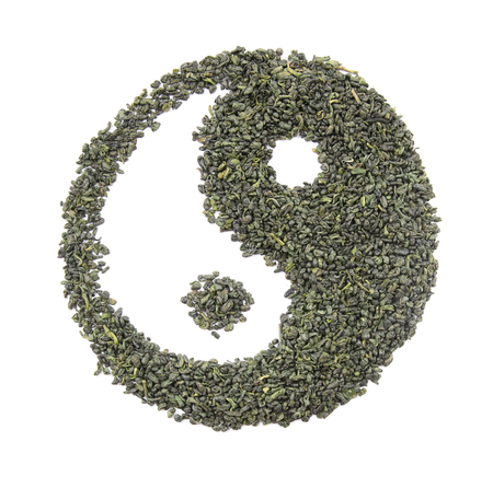 Ying yang sign made of dry tea, isolated on whiteの写真素材