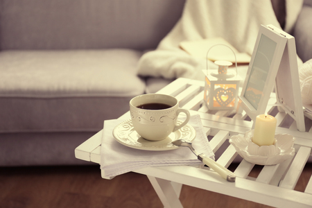 Cup of tea on coffee table in the room, close upの写真素材