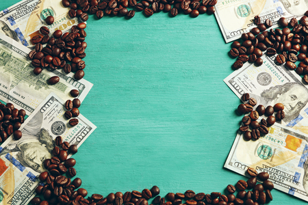Coffee beans and US dollar banknotesの写真素材