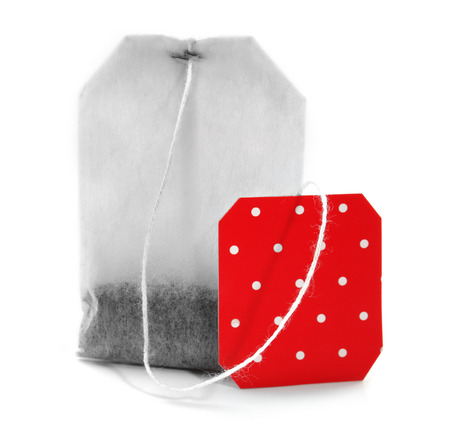 Teabag with red dotted label isolated on white backgroundの写真素材