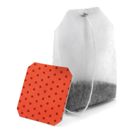 Teabag with red dotted label isolated on white backgroundの写真素材